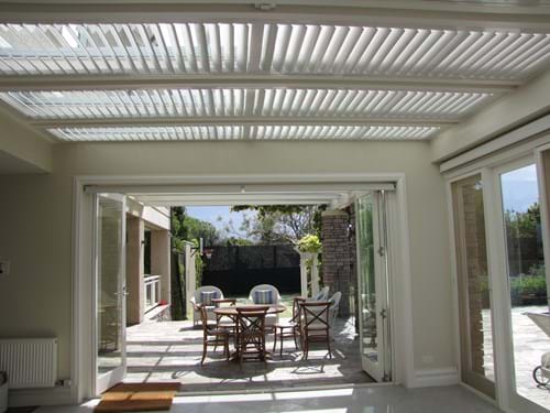 Block the heat but allow the light in with Atrium Louvre Blade Shutter Panel Screens by Bayside Privacy Screens
